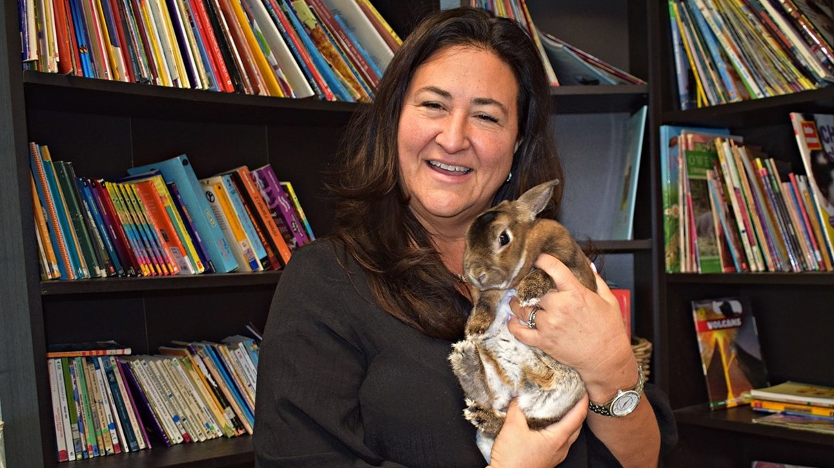 Educator Nathalie Mancuso holds a Rex rabbit used a as a comfort animal at Birchwood Elementary School in Saint Lazare on May 15, 2023