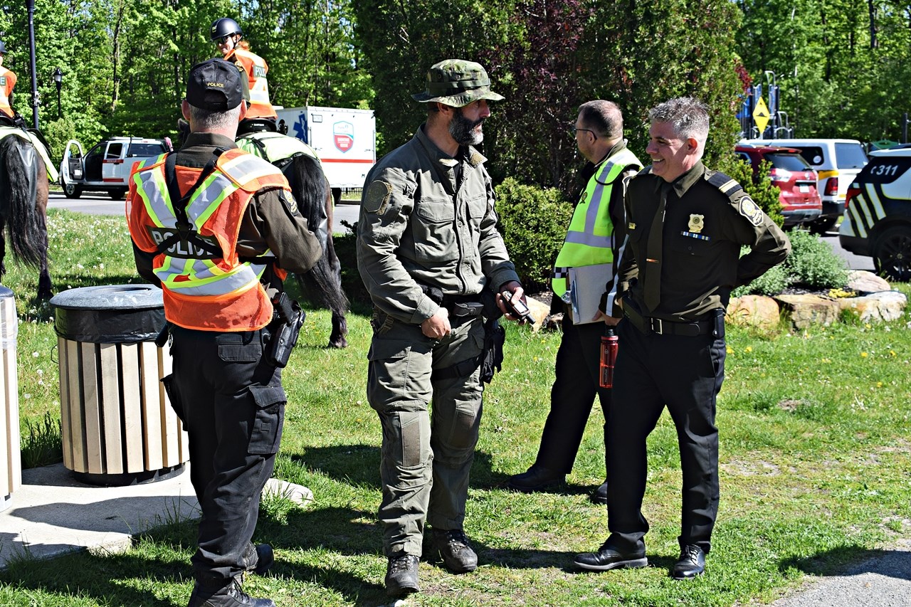 Sûreté du Québec police officers gather together on May 22 after Maurice Beauregard 82 and
his dog was found safe in a wooded area after being reported missing the previous day.