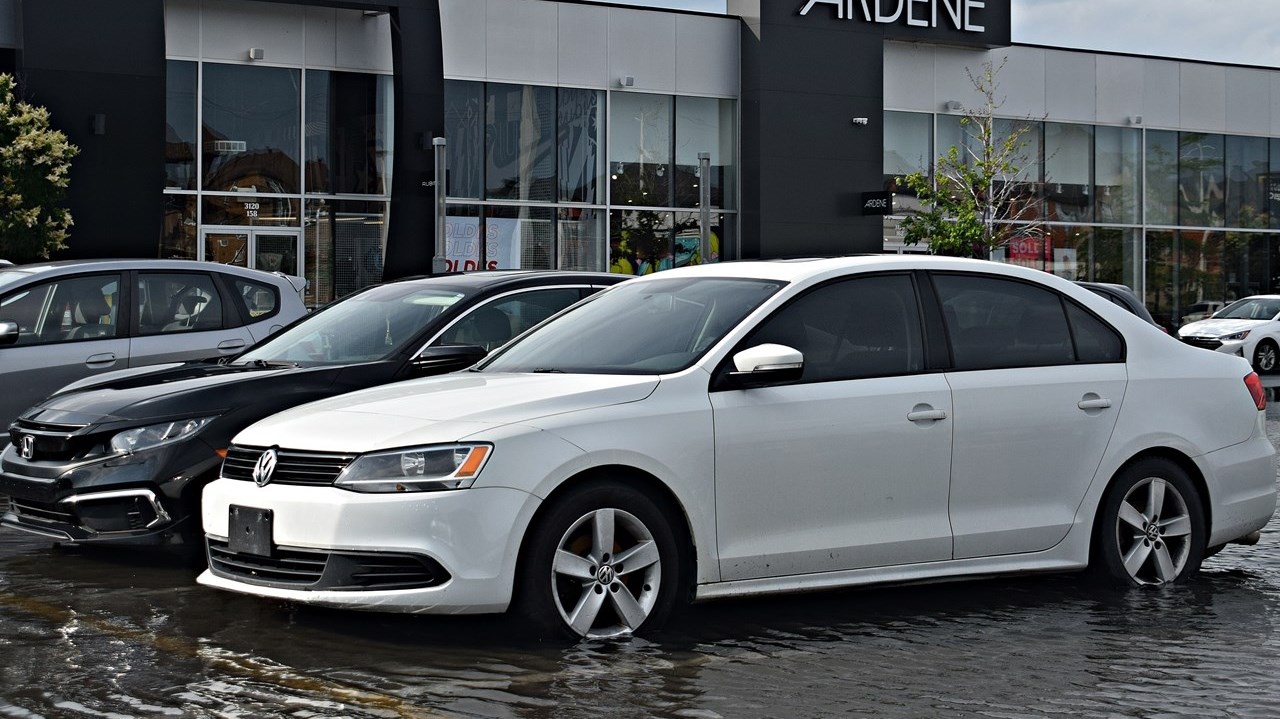 A flooded shopping mall parking lot near Boulevard de la Gare in Vaudreuil-Dorion on June 26.