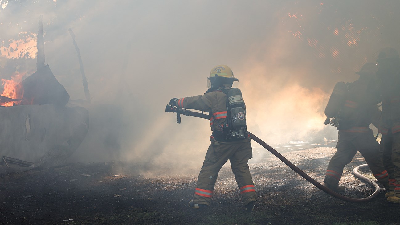 A garage is destroyed by flames