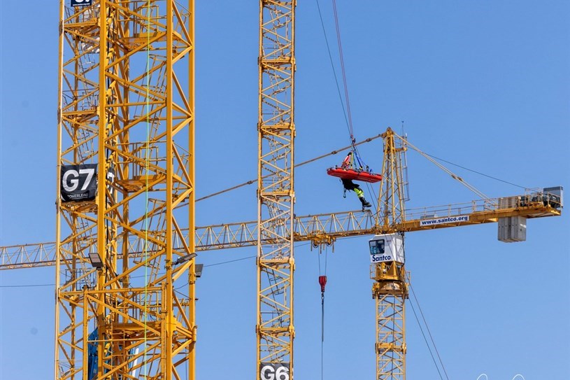 The region's firefighters practice their high-altitude rescue skills on the site of the future hospital