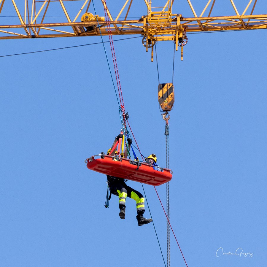 The region's firefighters practice their high-altitude rescue skills on the site of the future hospital