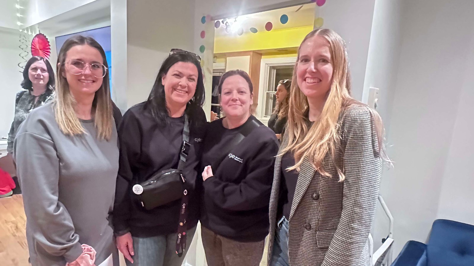 Executive Director Jessica Myre can be seen on the right.