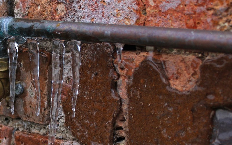 How can I prevent frozen pipes during the cold season?  